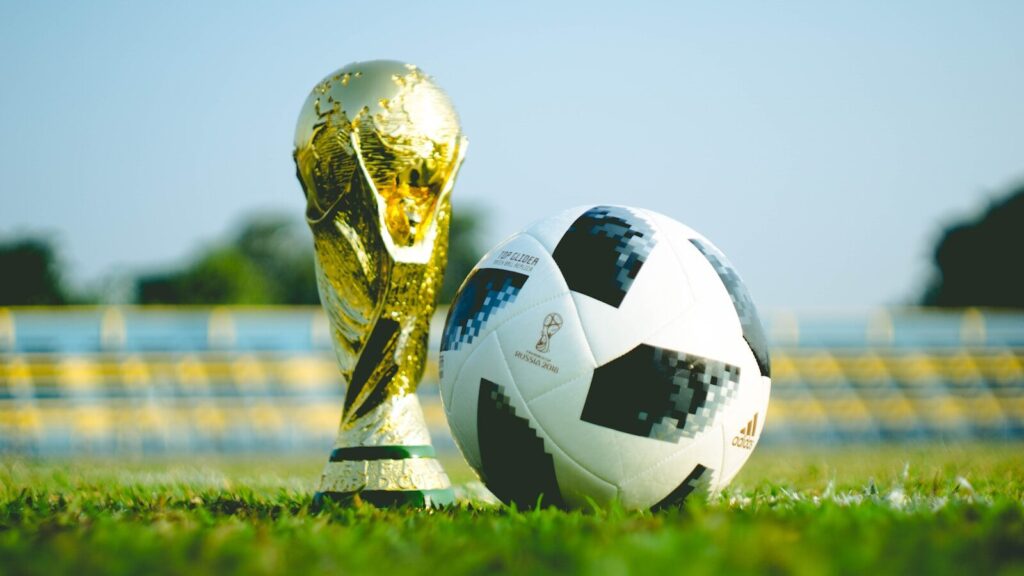 Direct : Allemagne – Côte d’Ivoire gold-colored trophy and soccerball